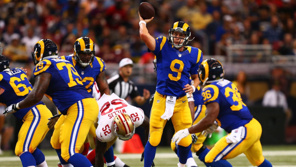 Image of Matthew Stafford throwing the ball for the Los Angeles Rams in a game before Super Bowl LVI.