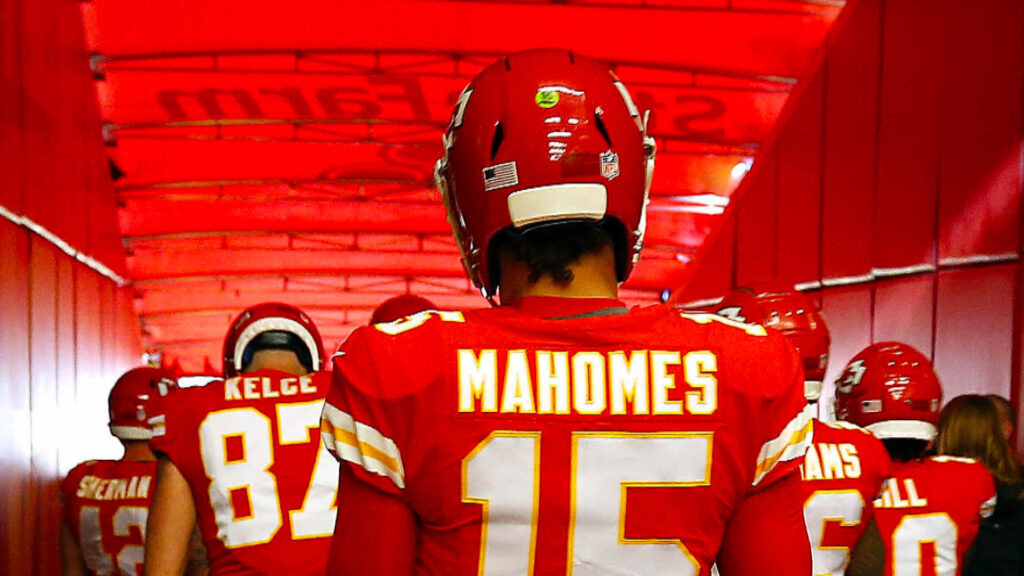 Photo of the back of Patrick Mahomes and teammates walking out on the field suggesting that you watch Super Bowl 2023 at Hibernia.