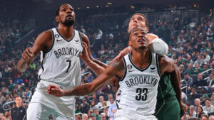 Photo of Nic Claxton playing with Brooklyn Nets teammates.