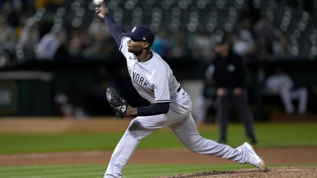 Yankees Mid-Season Review includes this image of Domingo German throwing a pitch during a Yankees game.
